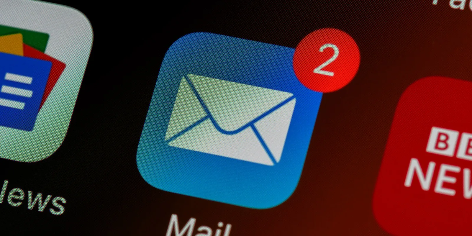 Person typing on a laptop with email marketing content